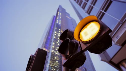 Countdown at traffic lights at crossroads in downtown London city, skyscrapers and building lights