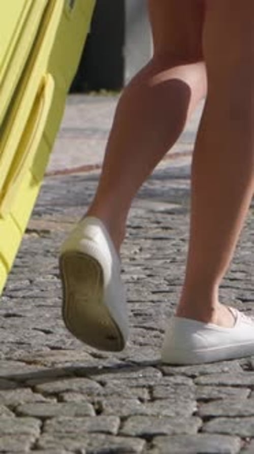 A Woman with a Suitcase is Heading to the Hotel Travel and Tourism Concept Vertical Video