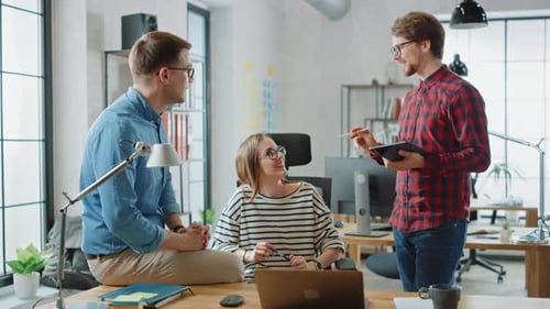 Creative Team Discussing Ideas in Modern Office