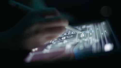 Designer Using Stylus on Digital Tablet Blueprint