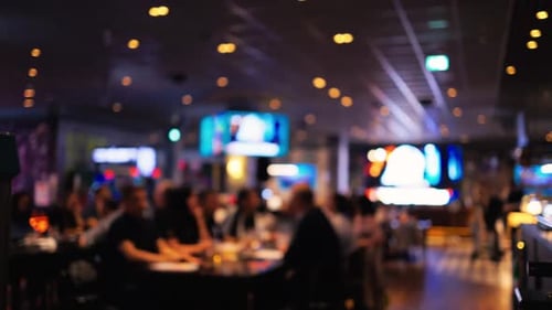 A Beautifully Blurred Background Showcasing a Vibrant Restaurant Scene Filled with Dynamic and Warm