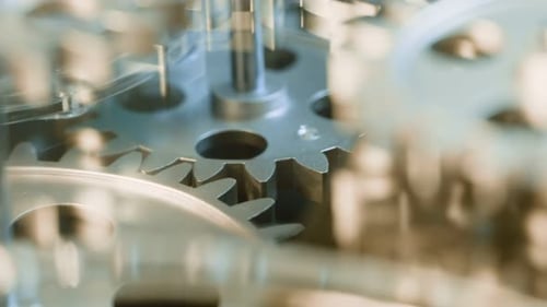 Silver Gears Turning Smoothly in Close Up View