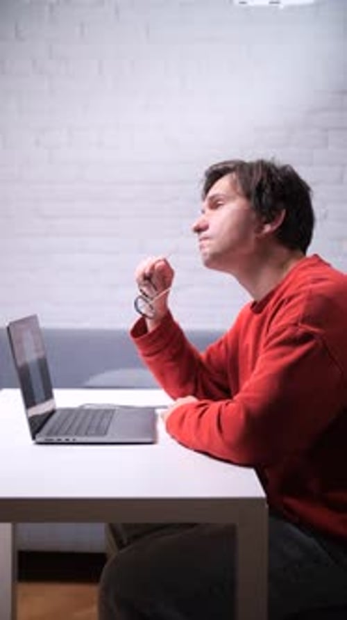 Vertical Video Pensive Entrepreneur Thinking and Planning New Business Ideas at Home Office