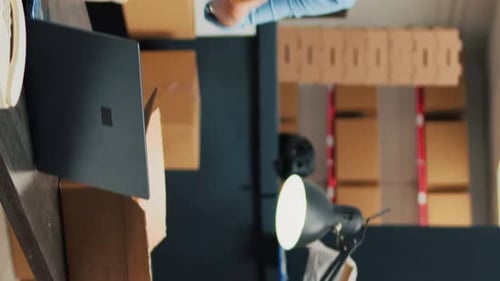 Business Woman Prepares Packages for Delivery in Office