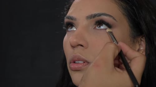 Eye Makeup Applied on Young Woman Close Up