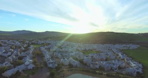 Real estate, houses in countryside with sunrise and drone, community in nature for development