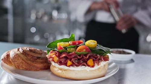 Chef Prepares Open-Faced Ham and Spinach Sandwich