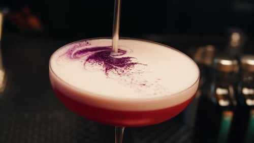 Bartender Make a Cocktail for Guest in the Bar Pink Foamy Sour Alcohol Drink Barman is Doing Drinks