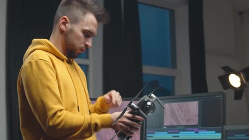 Freelance Videographer Colorist Editing Footage Using Professional Software Monitor and Montage