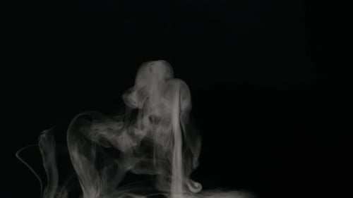 Wispy Smoke Rising on Black Background