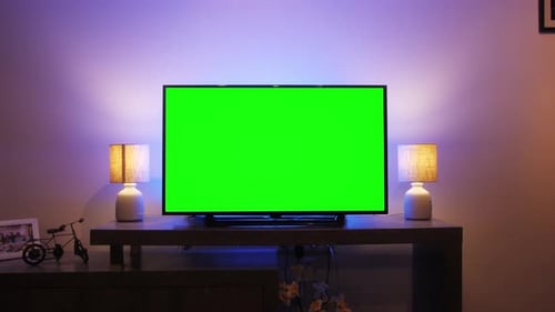 LcD Smart TV Screen with a Blank Green Background in the Living Room Chroma Key Screen for