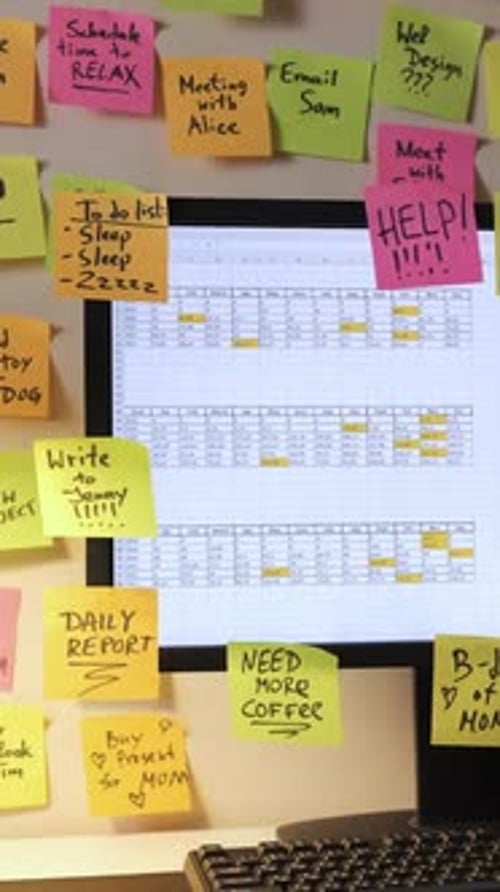 Computer Screen Covered in Sticky Notes