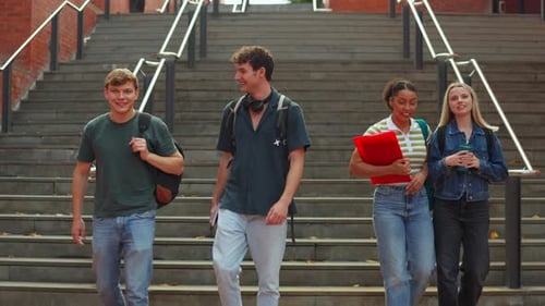 Diverse Group of University Students Walking Down Stairs