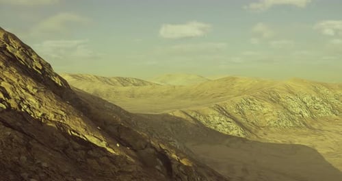 Mountain Landscape Showcases Rugged Terrain Under Soft Sunlight