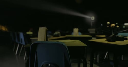 Dark Classroom with Projector Light and Solar System Model
