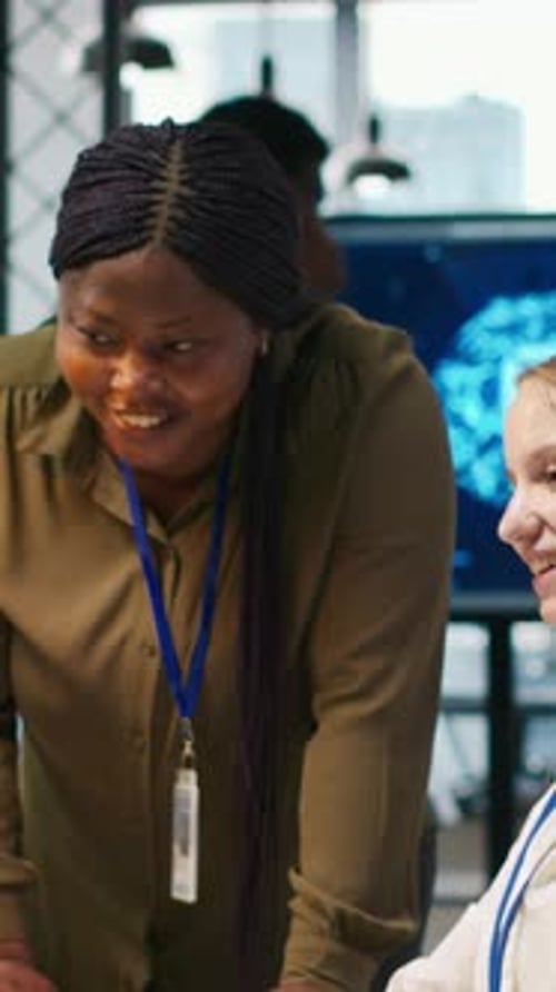 Women Collaborating on a Computer in Modern Office