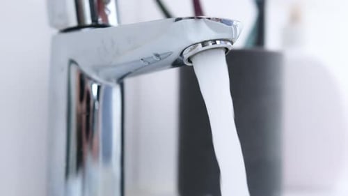 Running Water from a Chrome Bathroom Faucet