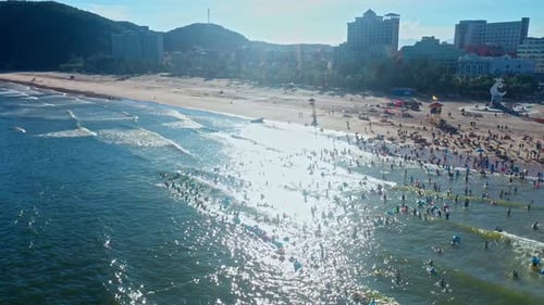 Aerial Top view of a transparent blue sea with beautiful waves at sunny day in summer. air of ocean