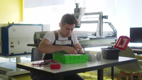 Electrician Assembles Electrical Panel Fuse Box in Workshop Worker Installs Energy Meter Switches