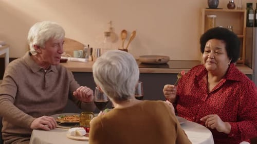 Seniors Enjoying Dinner Together at Home