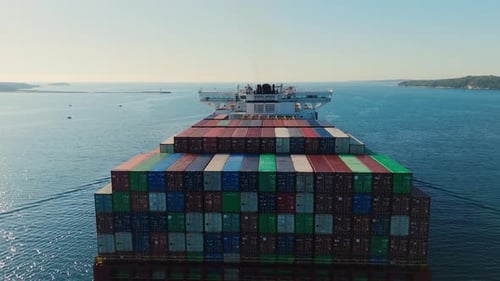 Export Ship Escorted By Tugboats From Halifax Into Open Sea Aerial View
