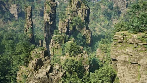 A Majestic Mountain Landscape with Trees Clinging to Its Rocky Surface