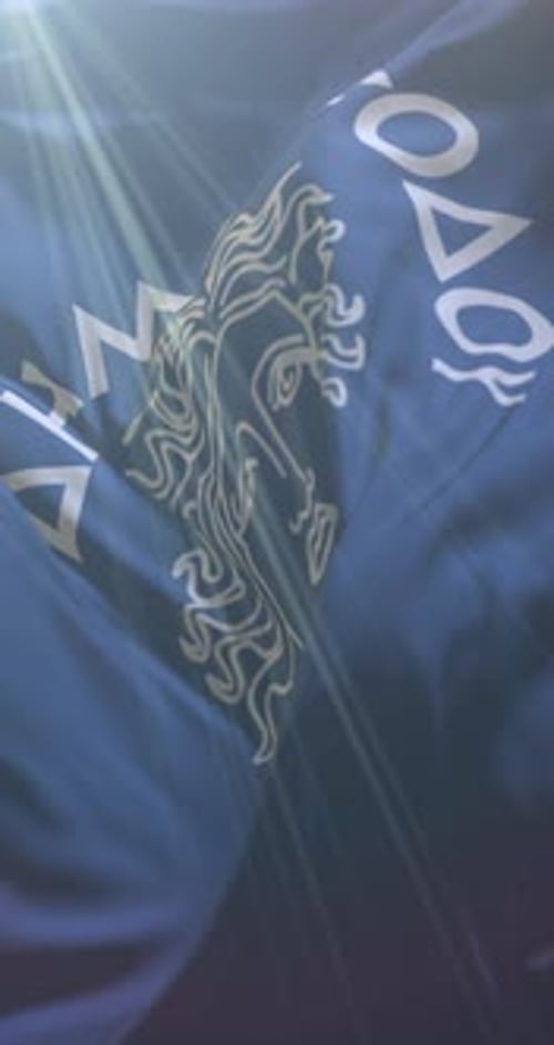 Waving Blue Fabric with White Stylized Design and Dynamic Text