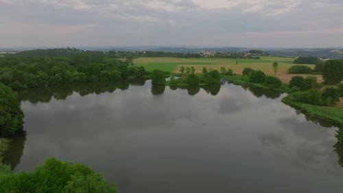 Aerial Footage of Reflective Forest Lake in Zen Tranquility