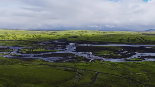 Aerial Braided Glacial Rivers Over Volcanic Plains in Iceland