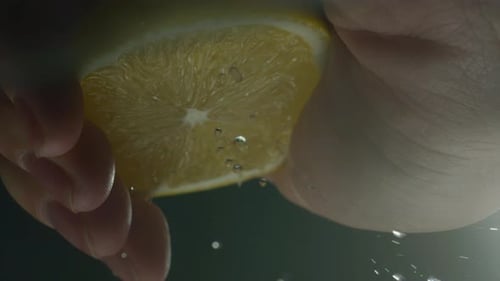 Juicy Lemon Being Squeezed Close Up