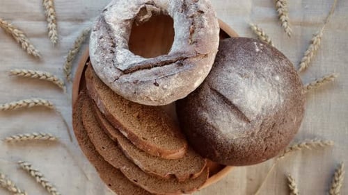 Baked Bread Loaf of Bread Fresh Bakery Products on Wooden Board Healthy Food Concept Top View Slices