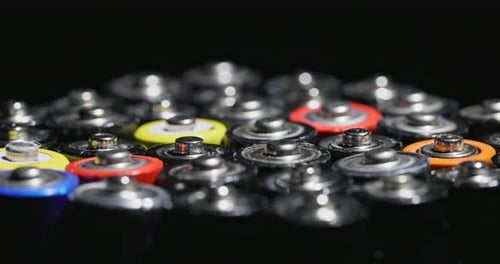 Batteries Close Up with Colorful Tops