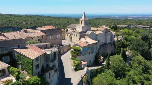 View of Venasque village with old church Notre Dame de Vie to landscape of Luberons, Provence, Franc