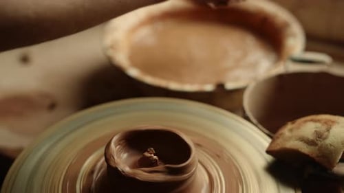 Closeup Woman Moistening Hands In Workshop. Unknown Girl Wetting Hands Before Sculpting In Studio...