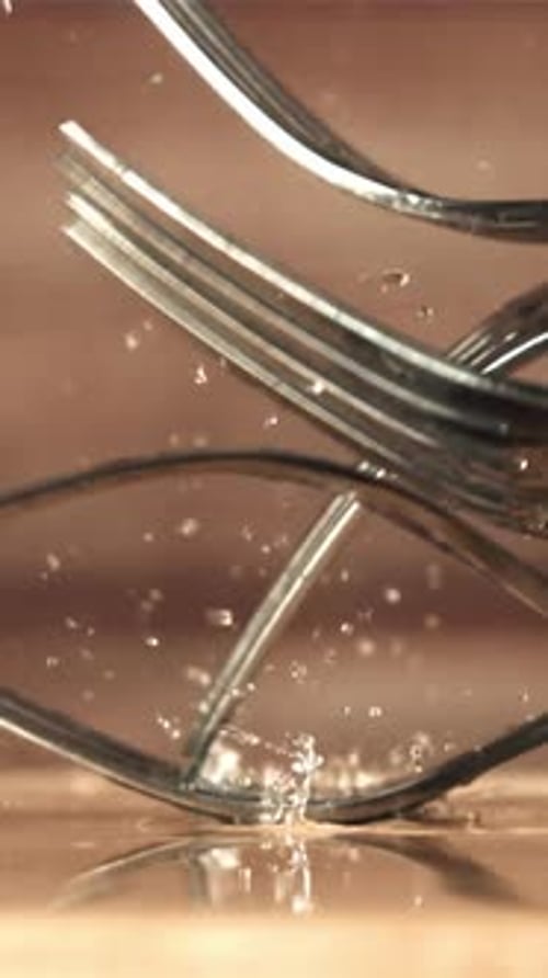 Forks Fall on a Wooden Table Filmed on a Highspeed Camera at 1000 Fps
