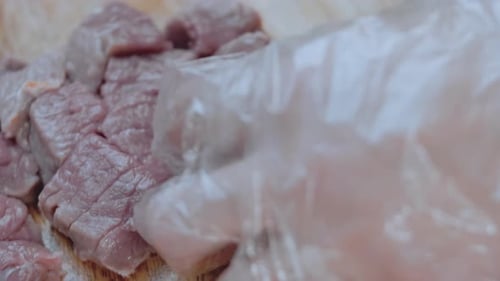 Cutting Raw Meat with a Metal Cleaver