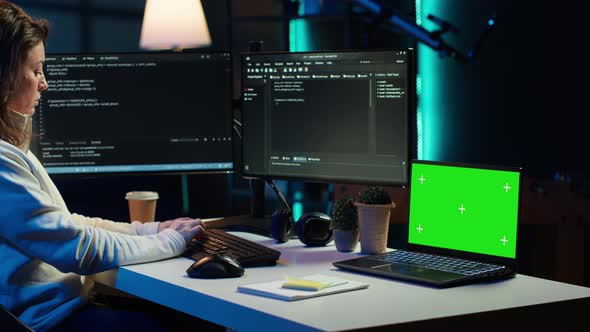 Programmer Using Green Screen Laptop to Secure Company Servers ...
