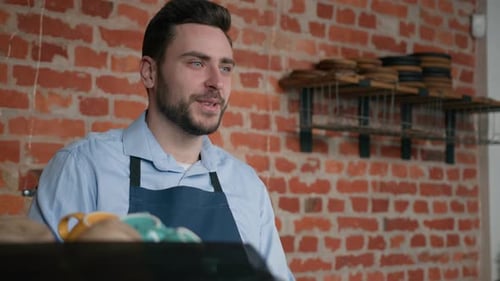 Smiling Friendly Caucasian Man Waiter Professional Barista Bartender Cafe Staff in Apron Taking