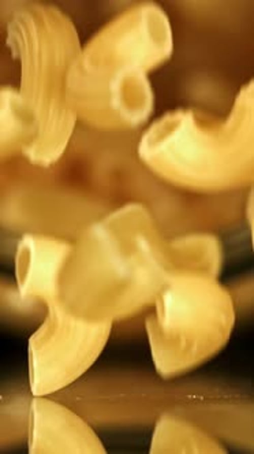 Super Slow Motion Dry Macaroni Pasta Filmed on a Highspeed Camera at 1000 Fps