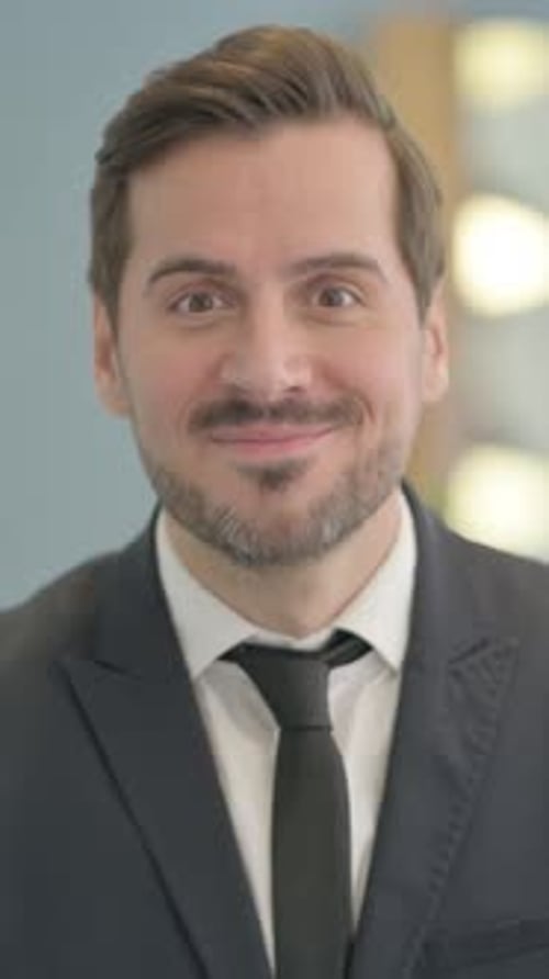 Happy Businessman Celebrating Success in Close Up Portrait