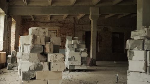 Several Pallets with Destroyed Building Blocks on the Construction Site