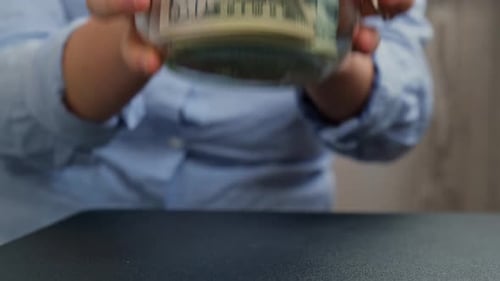 Charity Jar Filled with Fifty Dollar Bills