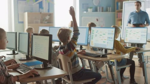 Elementary School Science Classroom: Teacher Educates Smart Little Schoolchildren who Work on Perso