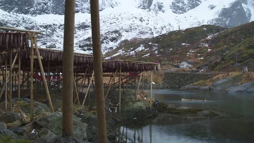 Cinematic tracking shot of stockfish racks