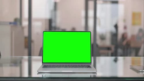 Laptop with Green Screen Chroma Key in Office