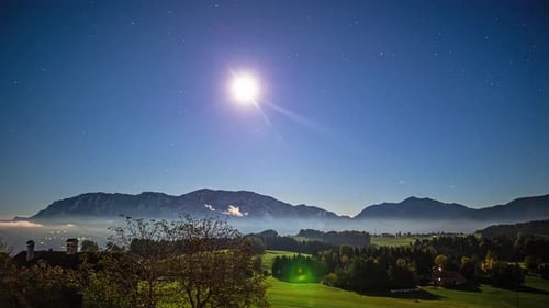 Day to night time lapse of a valley near the attersee in the Austrian Alps.
