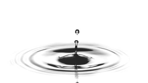 Drop of water falling and splashing in slow motion