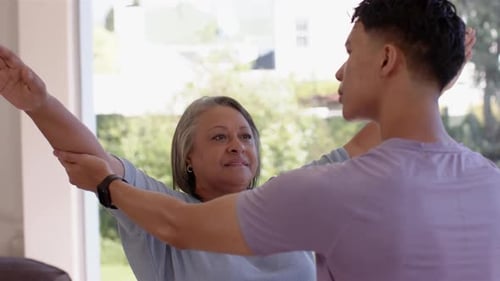 Woman Stretching Arms with Assistance