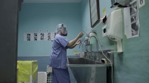 Surgeon Thoroughly Washing Hands in Hospital Setting