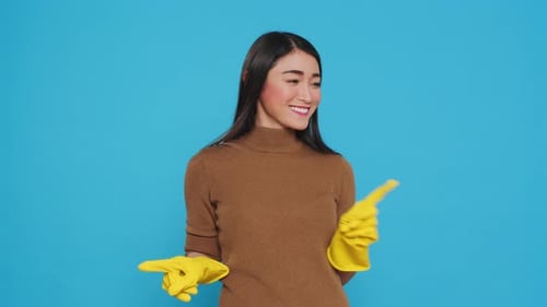 Professional Housekepper Pointing and Showing Cleaning Advertisement or Isolated Text